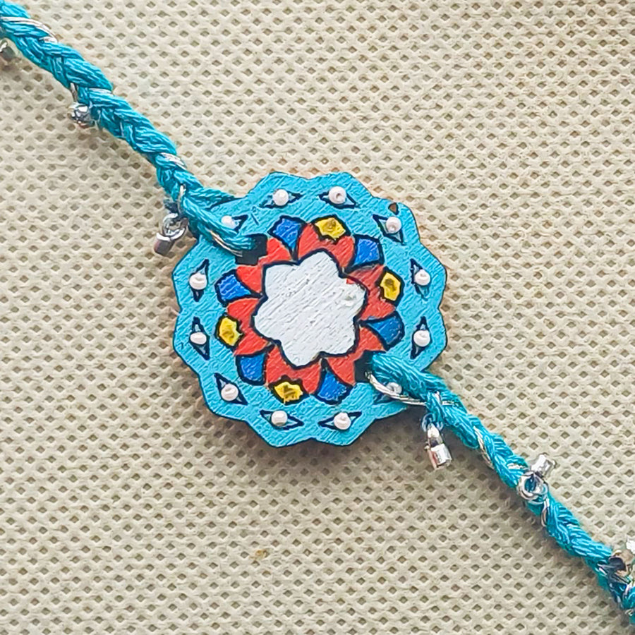 Handmade Blue Jaipuri Ghungroo Shell And Beads Wooden Lumba Rakhi For Bhabhi With Roli Chawal - Close-up of Pendant Detail