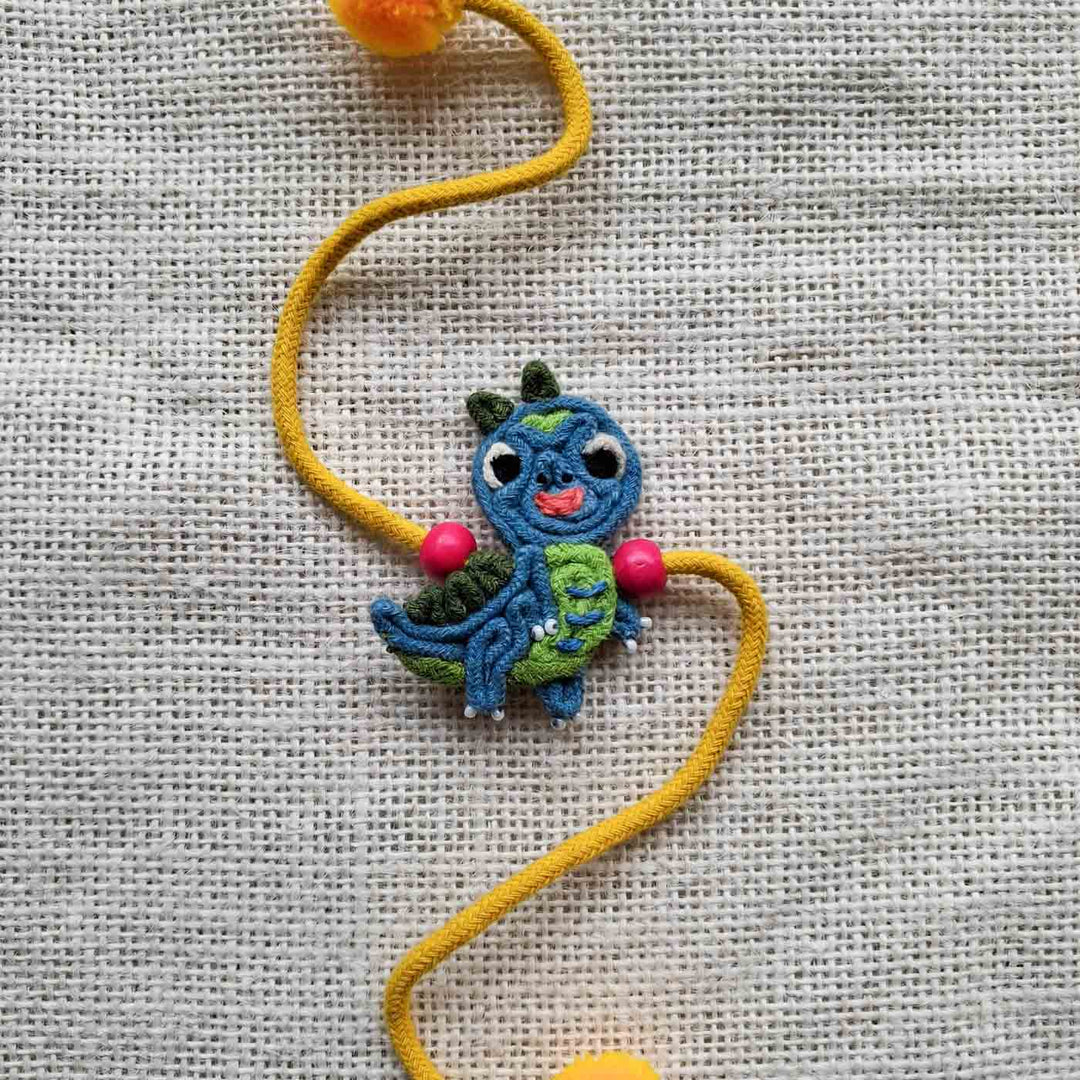 Handmade Doriwork Teal Dinosaur Kids Rakhi With Roli Chawal For Brother