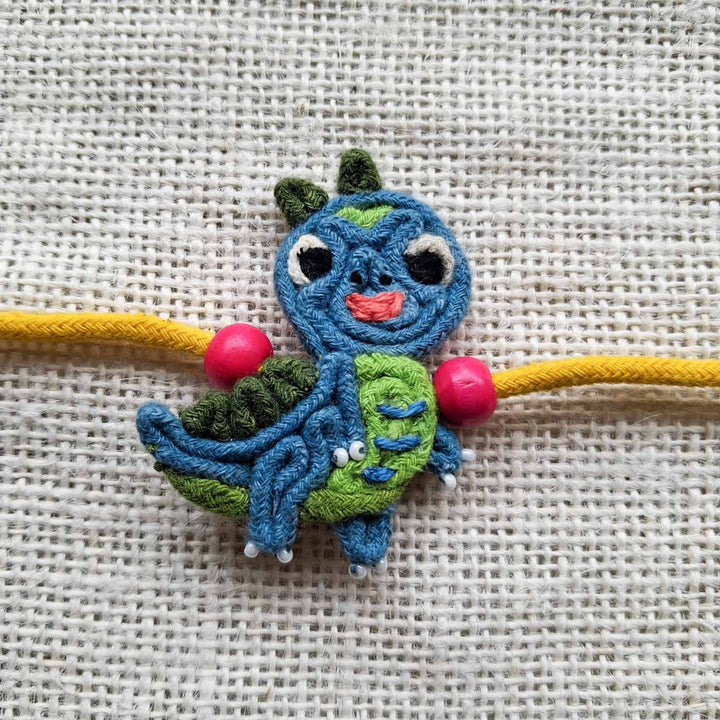 Handmade Doriwork Teal Dinosaur Kids Rakhi With Roli Chawal For Brother