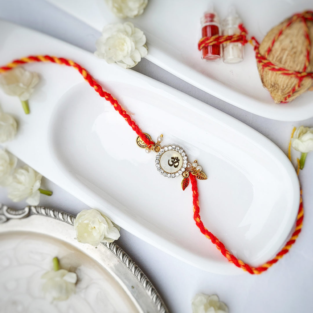 Handcrafted Brass-Cut Om White Stone Rakhi With Roli Chawal For Brother