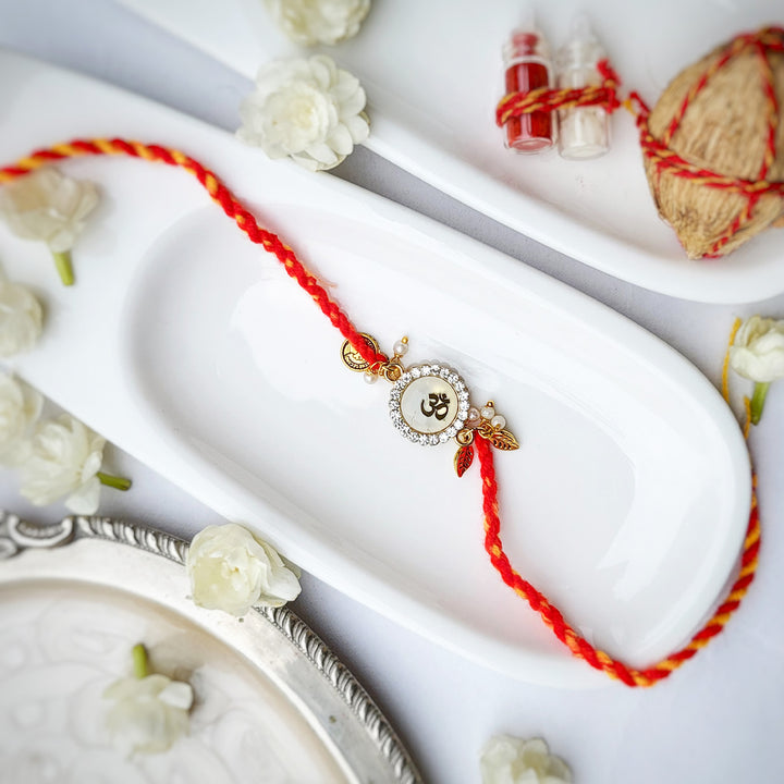Handcrafted Brass-Cut Om White Stone Rakhi With Roli Chawal For Brother
