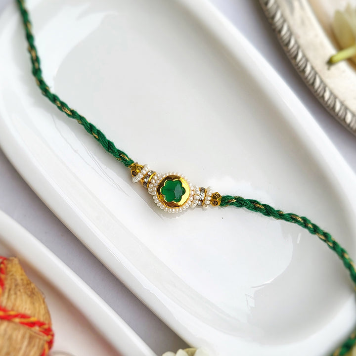 Handcrafted Jadau Kundan Emerald Green Bhai Rakhi with Pearl Bhabhi Bracelet | Set of 2