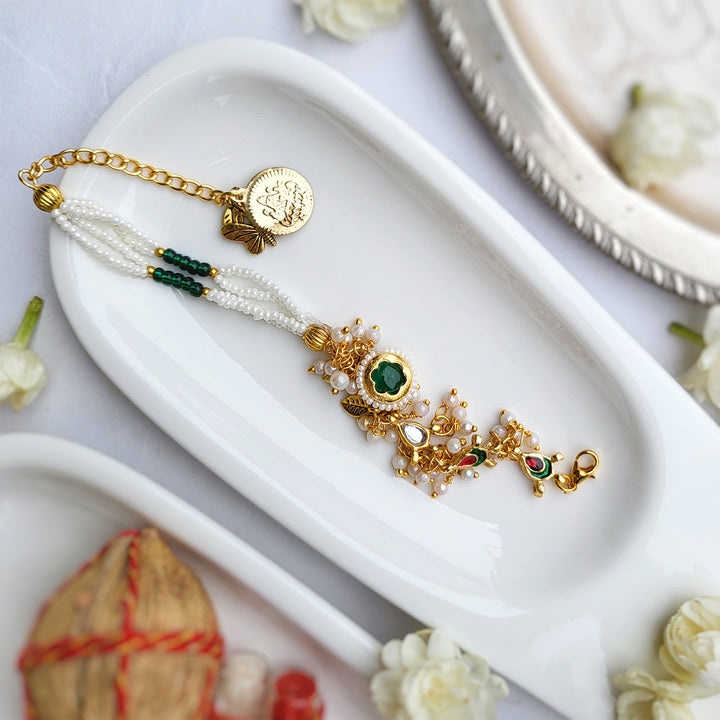 Handcrafted Jadau Kundan Emerald Green Bhai Rakhi with Pearl Bhabhi Bracelet | Set of 2