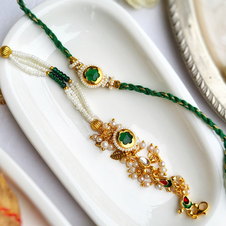 Handcrafted Jadau Kundan Emerald Green Bhai Rakhi with Pearl Bhabhi Bracelet | Set of 2
