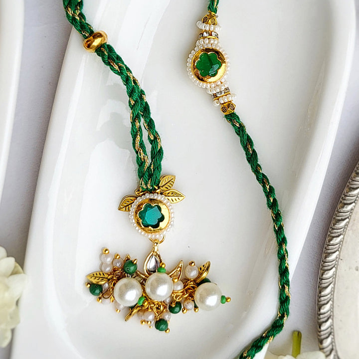 Handcrafted Jadau Kundan Emerald Green Bhai Rakhi with Indian Motif Bhabhi Cuff | Set of 2