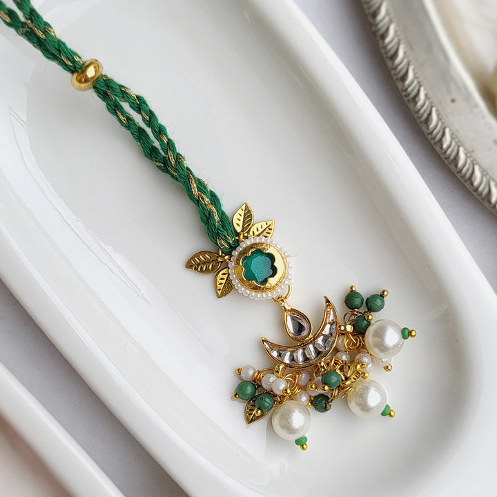 Handcrafted Jadau Kundan Emerald Green Bhai Rakhi with Indian Motif Bhabhi Cuff | Set of 2
