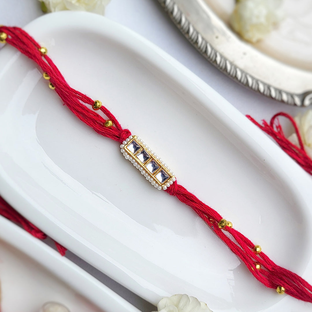 Handcrafted Kundan Red Bhai Rakhi with Pearl Bhabhi Bracelet | Set of 2