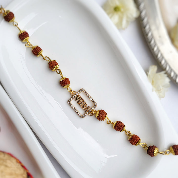 Handcrafted Laser-Cut Brass Veera Rudraksha Rakhi With Roli Chawal For Brother