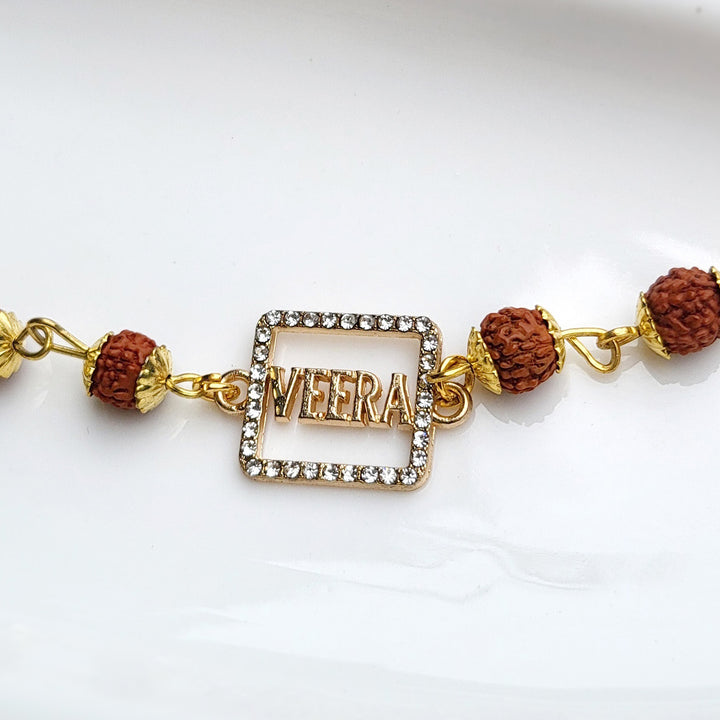 Handcrafted Laser-Cut Brass Veera Rudraksha Rakhi With Roli Chawal For Brother