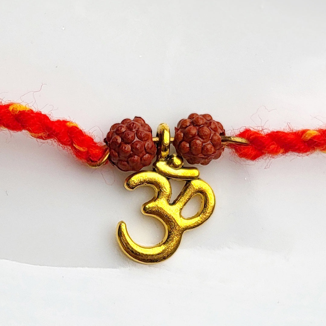 Handcrafted Brass-Cut Om Double Rudraksha Rakhi With Roli Chawal For Brother