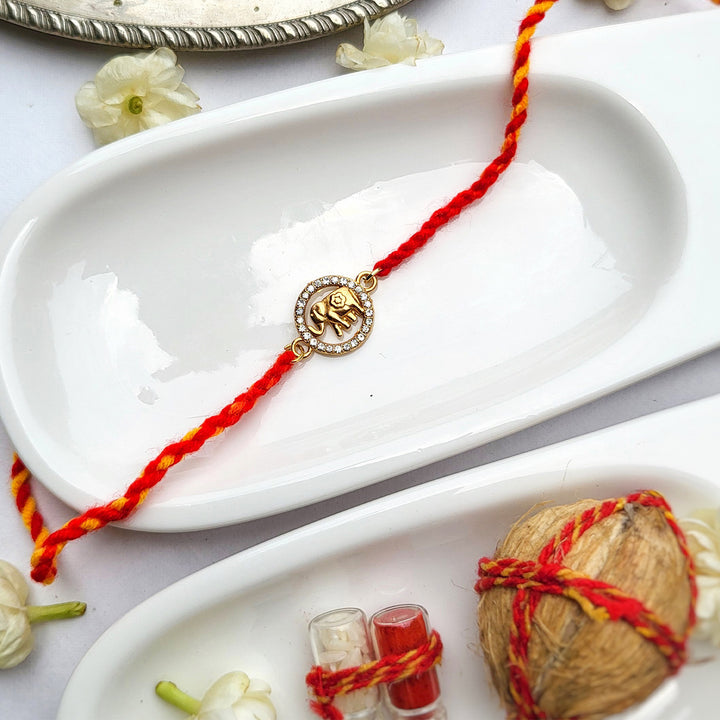 Handcrafted Brass-Cut Elephant Rakhi with Sparkling Stone Accents For Brother