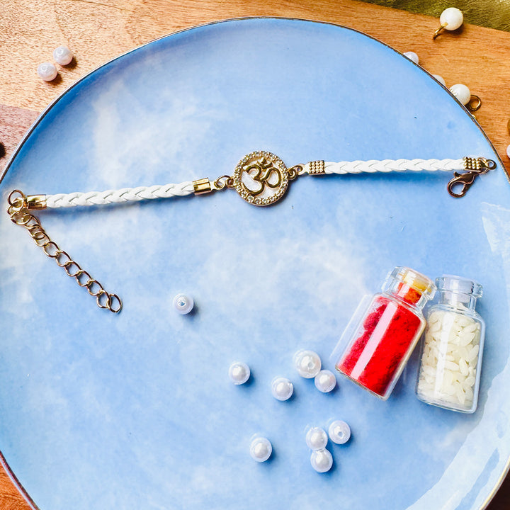 Reusable Handmade Om Charm - White Leather & Acrylic Band Rakhi With Roli Chawal For Brother