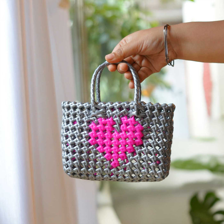 Handwoven Grey Small Plastic Wire Koodai Bag With Pink Heart Motif For Festive Return Gifts