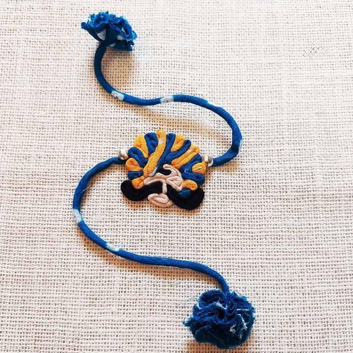 Handmade Dori Work Ethnic Rabari Rakhi With Roli Chawal - Flat Lay Blue Thread Bracelet