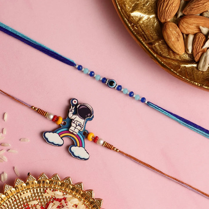 Handmade Beaded Astronaut & Evil Eye Kids Rakhi With Roli Chawal | Set Of 2