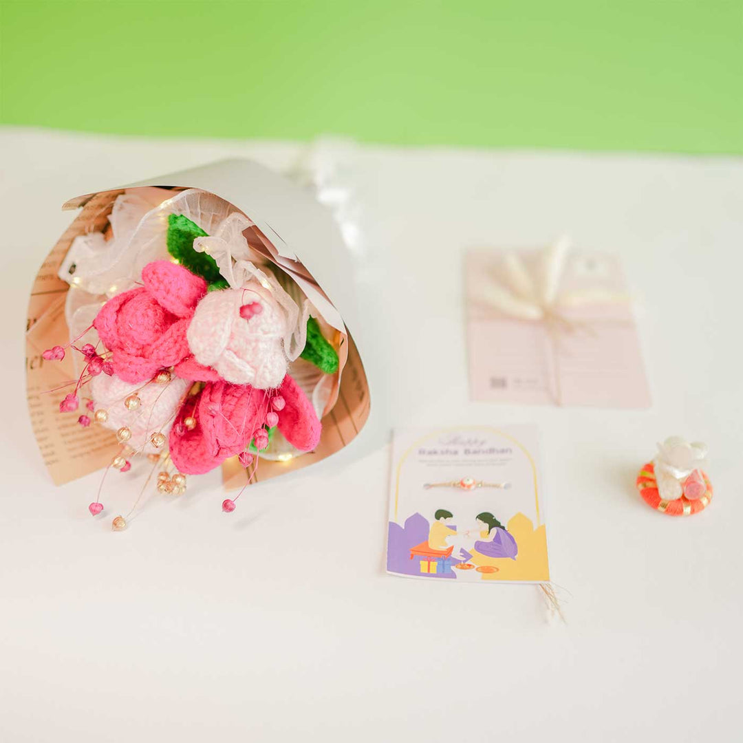 Personalized Handmade Crochet Pretty Pansy Rakhi Hamper Includes 1 Crochet Flower Bunch 1 Message Card And 1 Rakhi And Roli Chawal - Flat Lay with Accessories