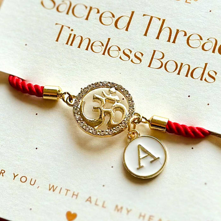 Personalized Handmade Om Design Monogram Metal Rakhi - Bracelet on Branded Message Card