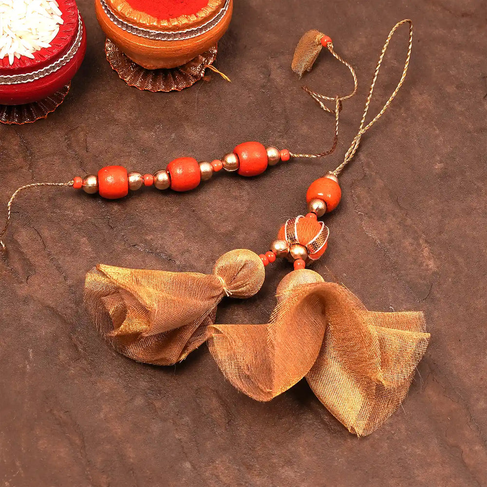 Handmade Beaded Swarn Kesari Bhaiya Bhabhi Rakhi With Roli Chawal Set Of 2 - Styled with traditional containers