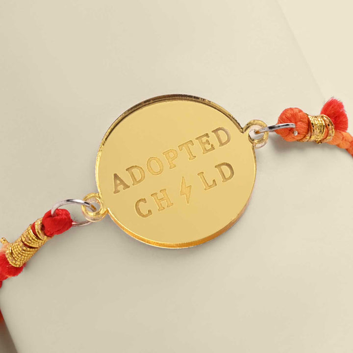 Handmade Adopted Child Design Acrylic Rakhi For Siblings - Engraving Close-up
