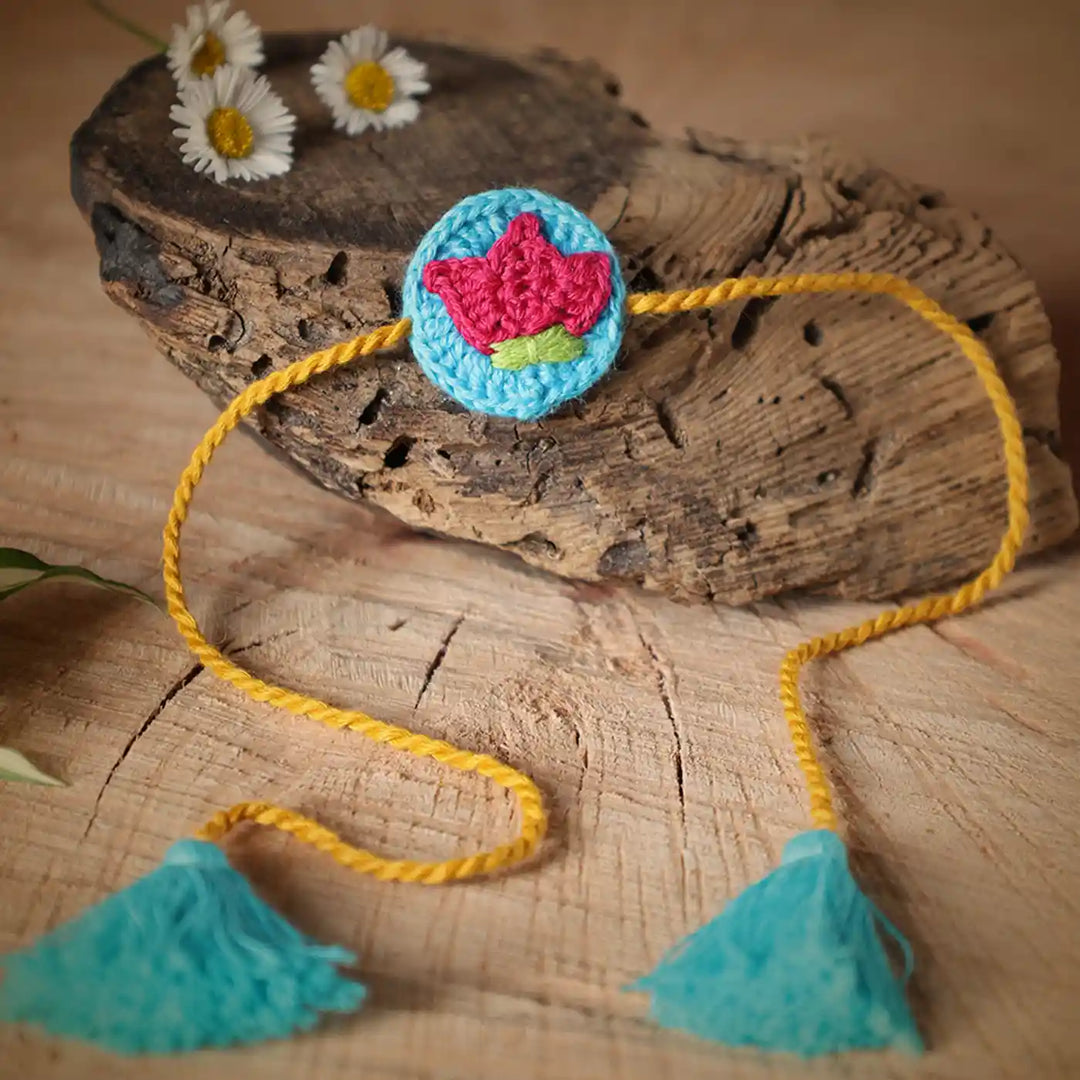 Handmade Crochet Lotus Rakhi And Tealight Holder Combo With Roli Chawal Set Of 2 - Close-up on Embroidered Flower String