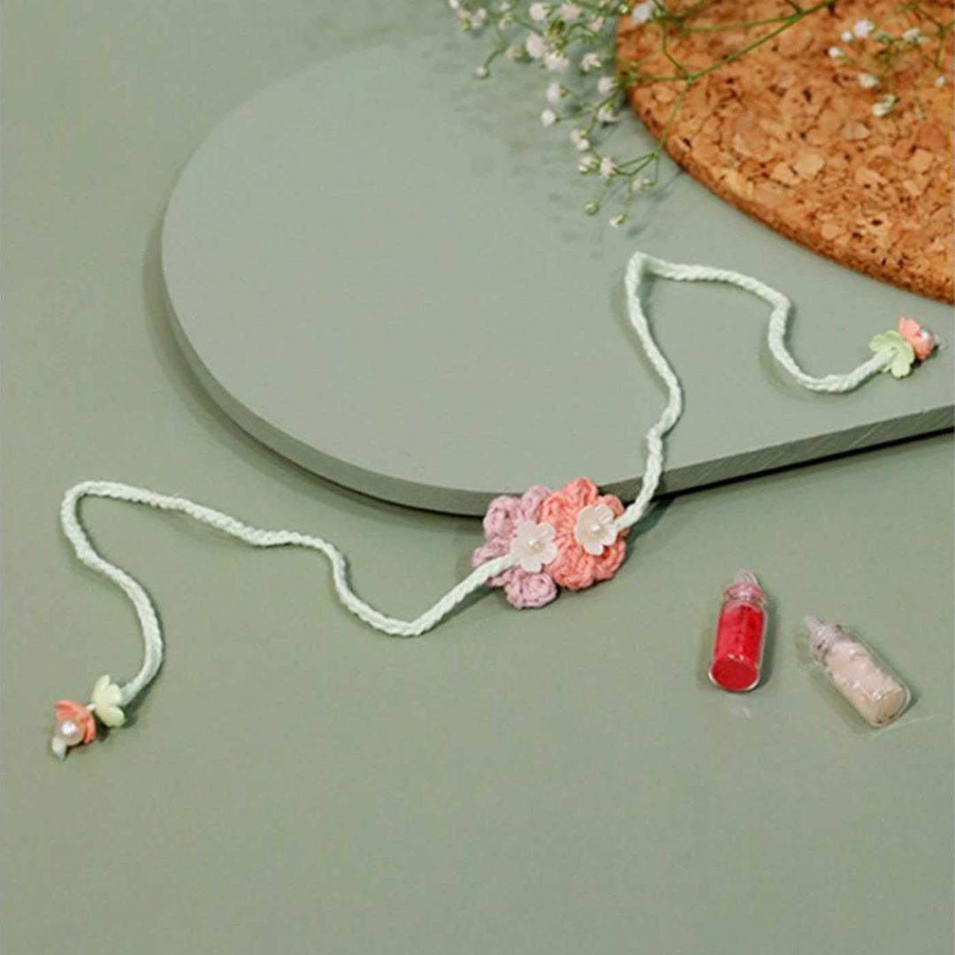 Handmade Crochet Forever Flowers Kids Rakhi With Roli Chawal Copy - Pink flower crochet necklace laid flat