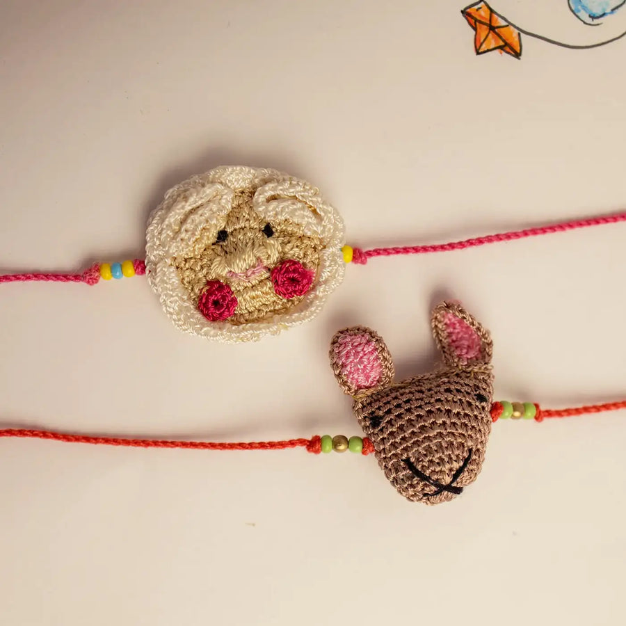 Handmade Crochet Sheep And Mice Theme Kids Rakhi With Roli Chawal Set Of 2 - Flat Lay Front View