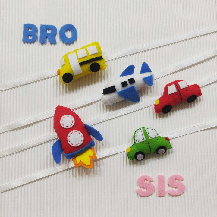 Handmade Bus Theme Felt Kids Rakhi With Roli Chawal - Multiple items arranged with text props