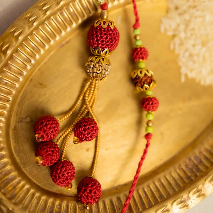 Handmade Crochet Rudraksh Bhaiya Bhabhi Rakhi With Roli Chawal Set Of 2 - Macro view of bead and tassel design