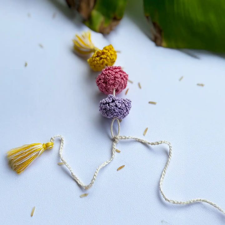 Handmade Crochet Marigold Lumba Rakhi For Bhabhi With Roli Chawal