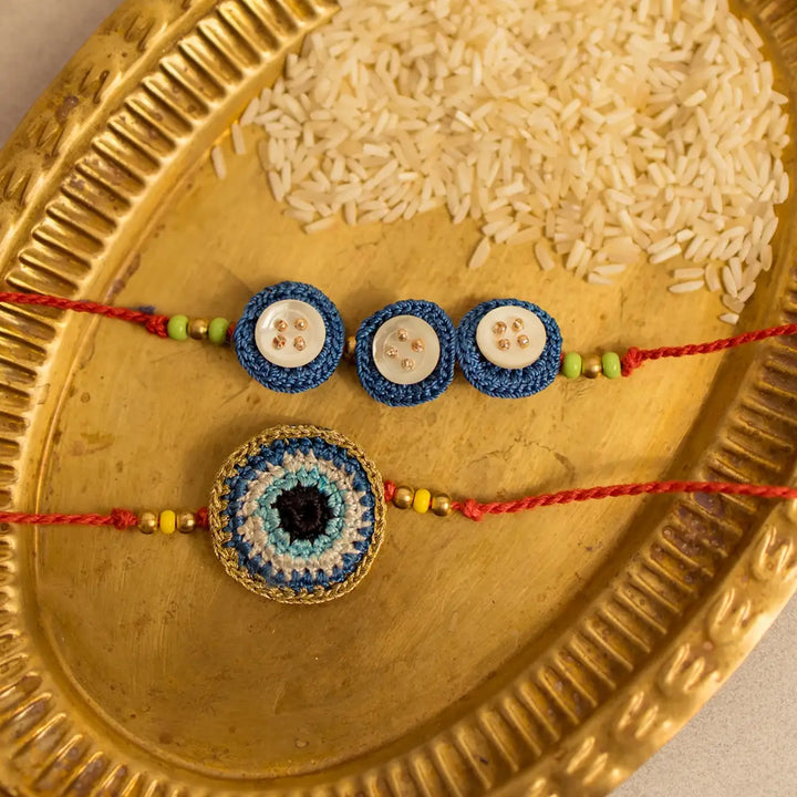 Handmade Crochet Noor And Nazar Evil Eye Rakhi With Roli Chawal Set Of 2 - Close-up on two bracelets