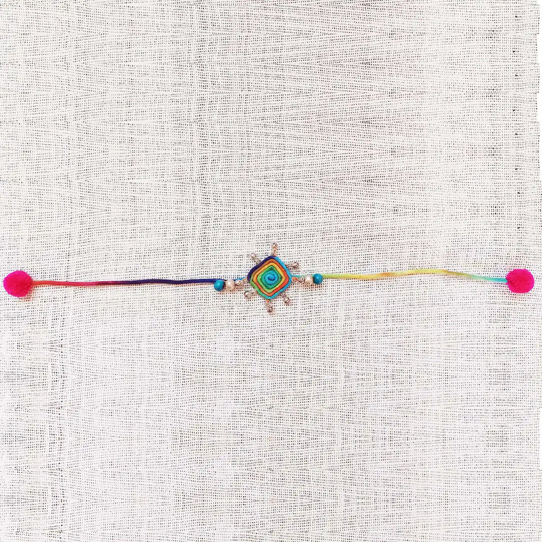 Handmade Dori Work Beaded Multicolor Rakhi With Roli Chawal - Full Length Laid Flat View