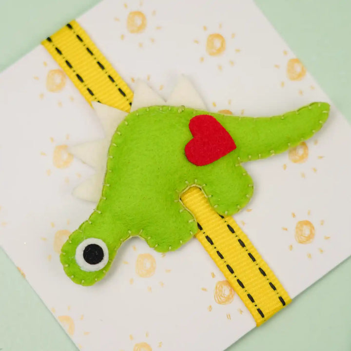 Handmade Dino Theme Felt Kids Rakhi With Roli Chawal - Front View