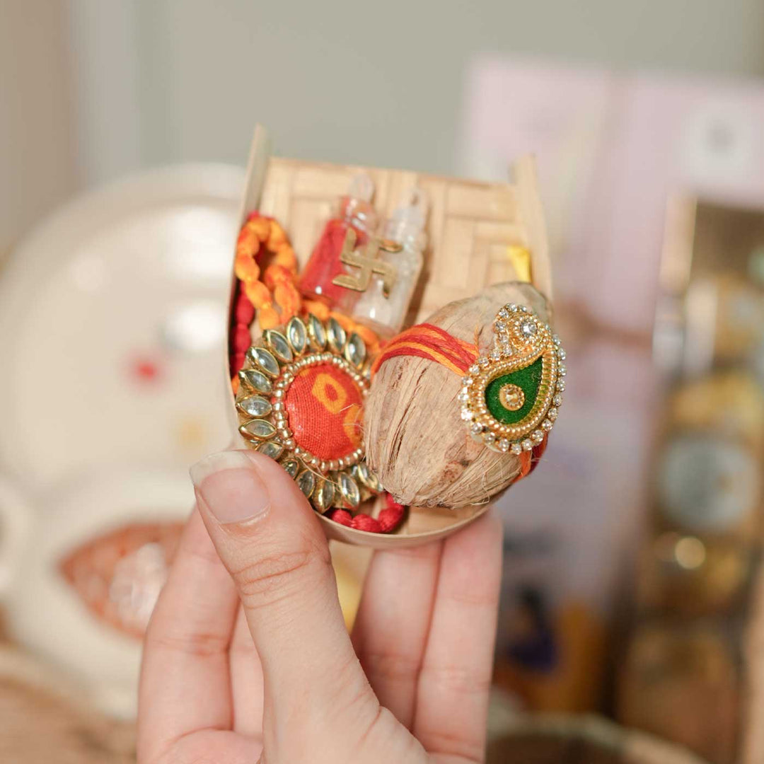 Personalized Handmade Foodie Theme Rakhi Hamper Includes 1 Basket 1 Plate 1 Mug 1 Rakhis 1 Roli Chawal 1 Chocolate And 1 Message Card - Hand Holding Pooja Thali Set