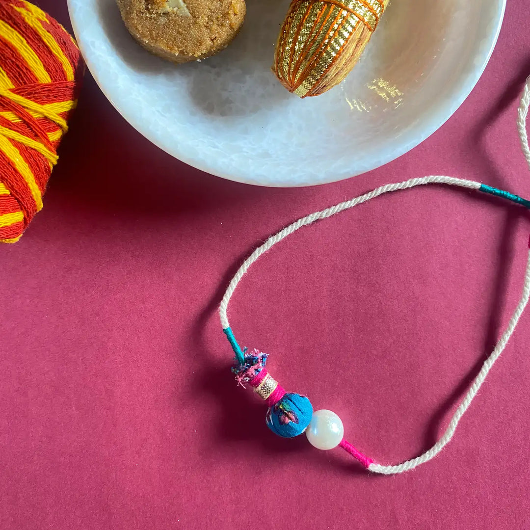 Handmade Ecofriendly Jhoomar Pearl Rakhi With Roli Chawal