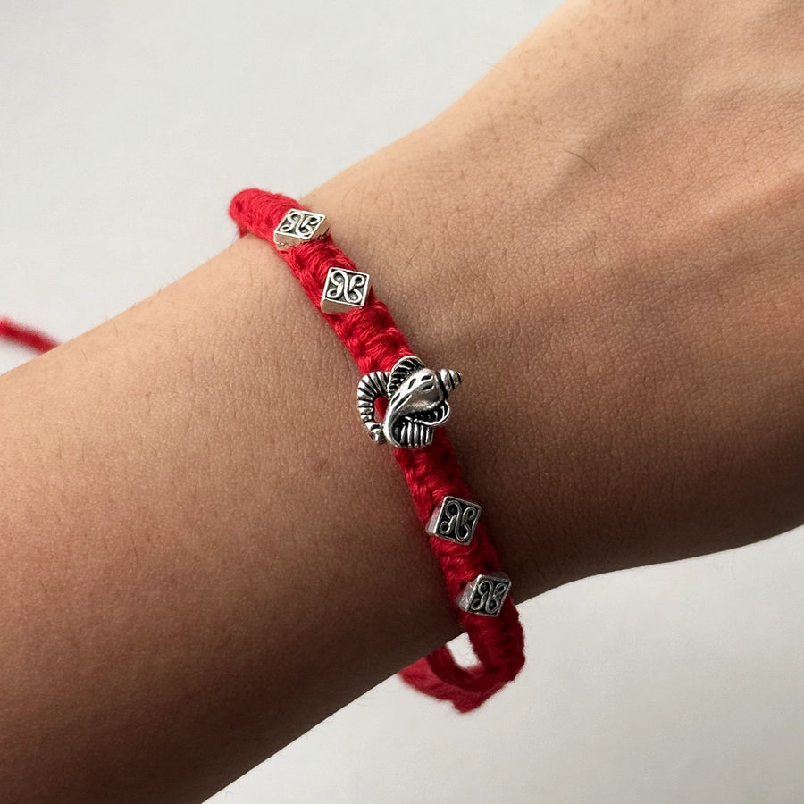 Handmade Ganpati Motif Rakhi With Roli Chawal - Worn on wrist close-up