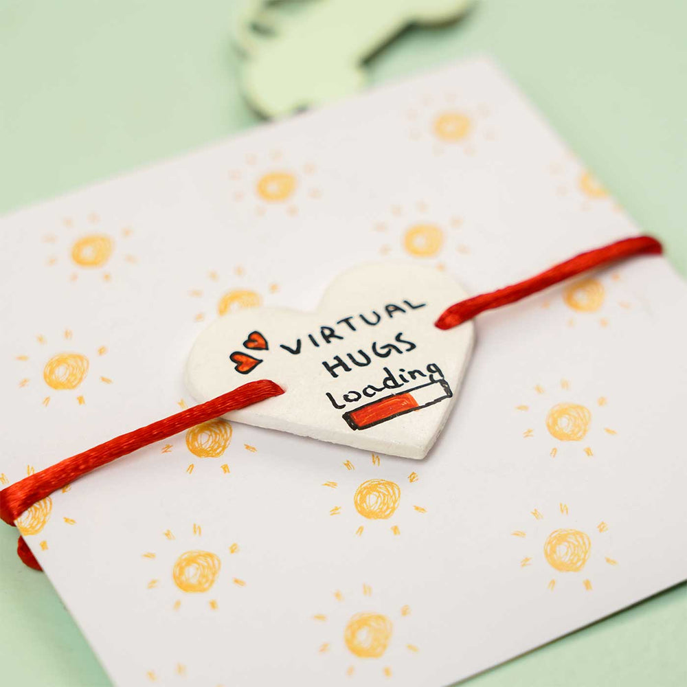 Personalized Hand Painted Virtual Hug Clay Rakhi With Roli Chawal - Heart charm bracelet on gift card