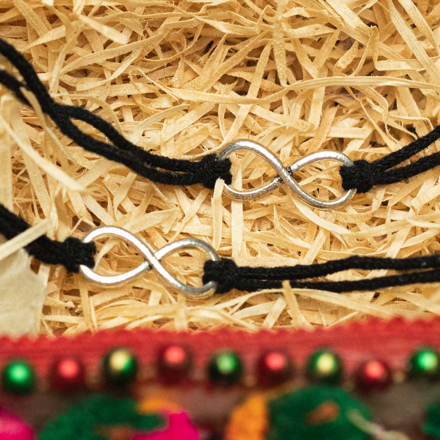 Handmade Sibling Bond Metal Bhaiya Bhabhi Rakhi - Close-up of Bracelet Charms