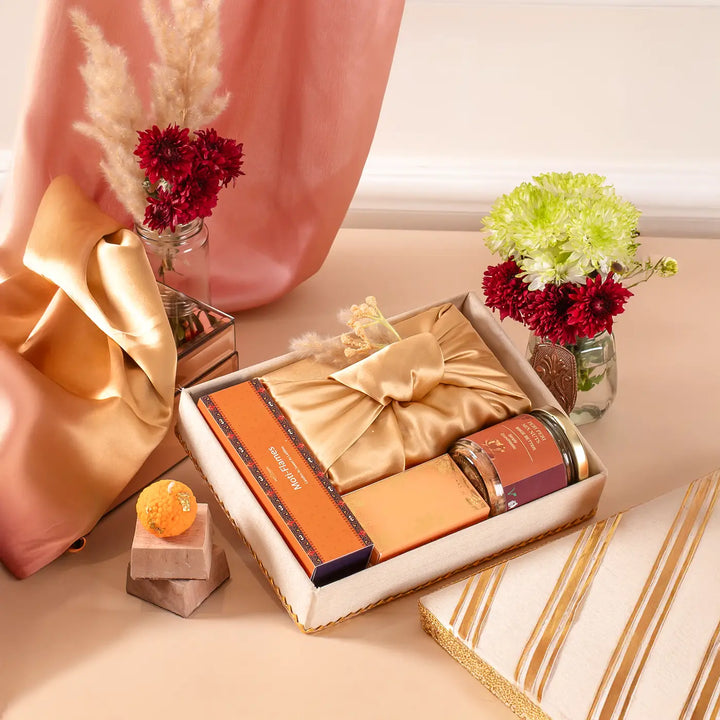 Exquisite Diwali Delights Gift Hamper | Includes 4 Laddoo Candles, 1 Moong Barfi Box, 1 Mix Nuts Jar, 1 Tilak Set, 1 Gift Box