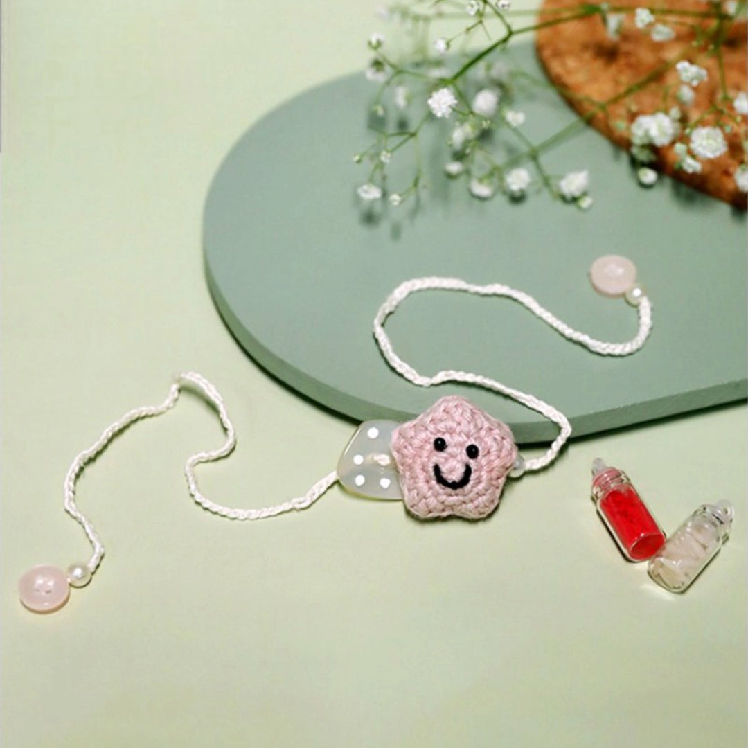 Handmade Crochet Little Star Kids Rakhi With Roli Chawal For Newborns - Unfolded Pink Star Bracelet
