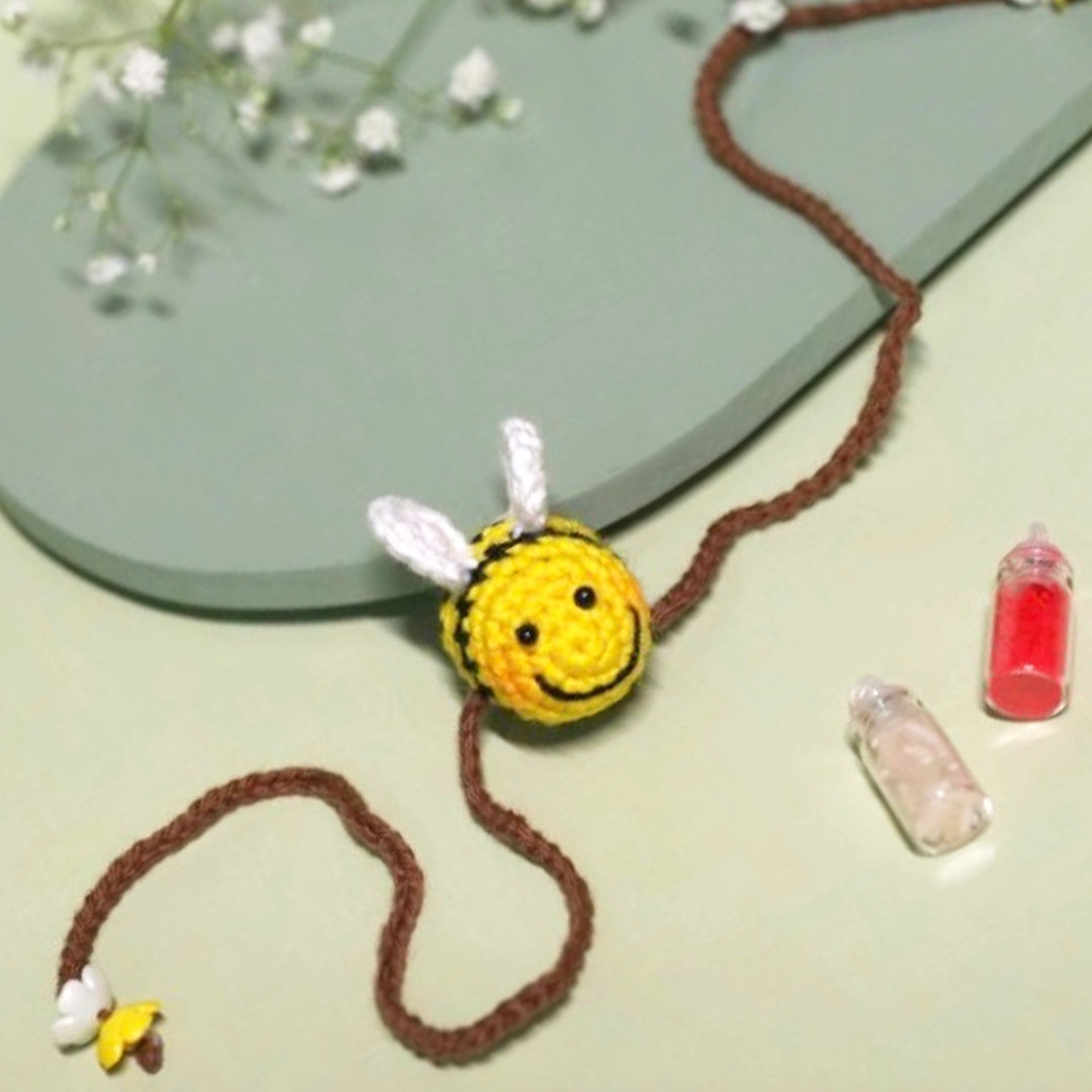 Handmade Crochet Honeybee Kids Rakhi With Roli Chawal - Flat Lay Display Repeat