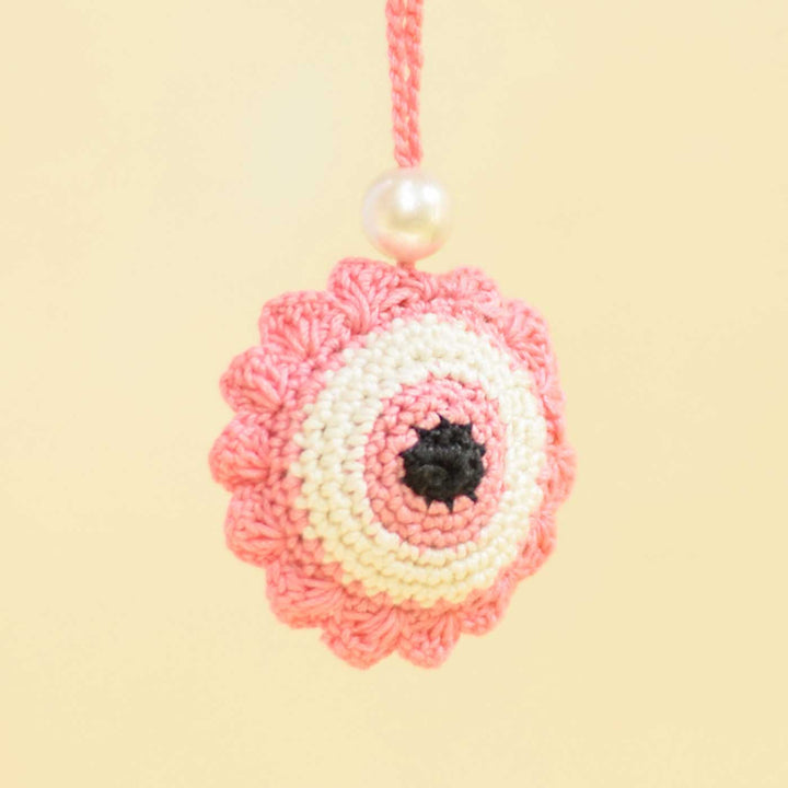 Handmade Crochet Evil Eye Design Cotton Lumba Rakhi For Bhabhi - Close-up Hanging View