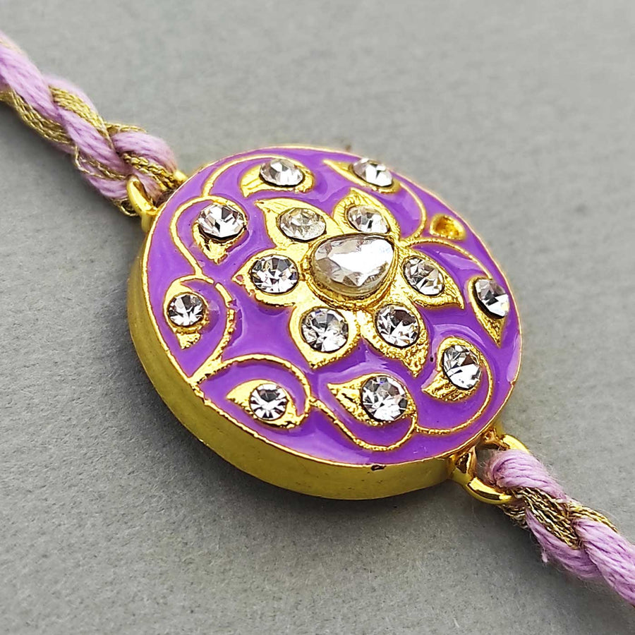 Handmade Meenakari Purple Buta Brass Rakhi With Roli Chawal - Close-up of Rakhi design