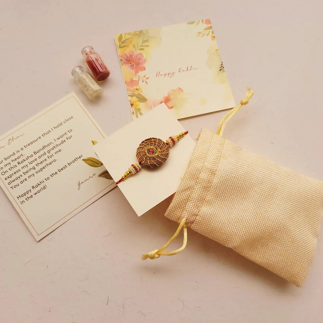 Eco Friendly Handmade Red Stone Pine Needle Rakhi With Pouch And Roli Chawal - Gift Set with Card and Pouch