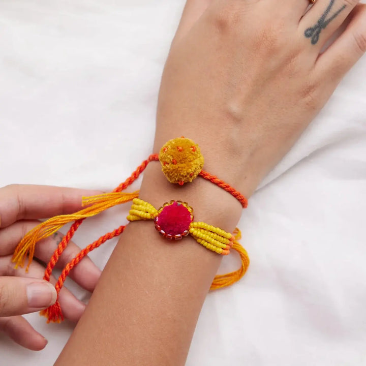 4 pc Rakhi + Brass Thali Set | Premium Zoey Beads & Pom Pom Rakhi Set with Roli Chawal