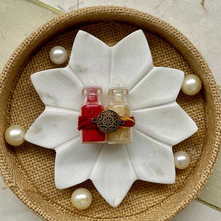 Handmade Sacred Threads Rakhi Hamper Includes 1 Marble Lotus 1 Tilak Bowl 1 Roli Chawal 1 Pooja Thali And 1 Set Bhaiya Bhabhi Rakhi - Marble lotus with small bottles