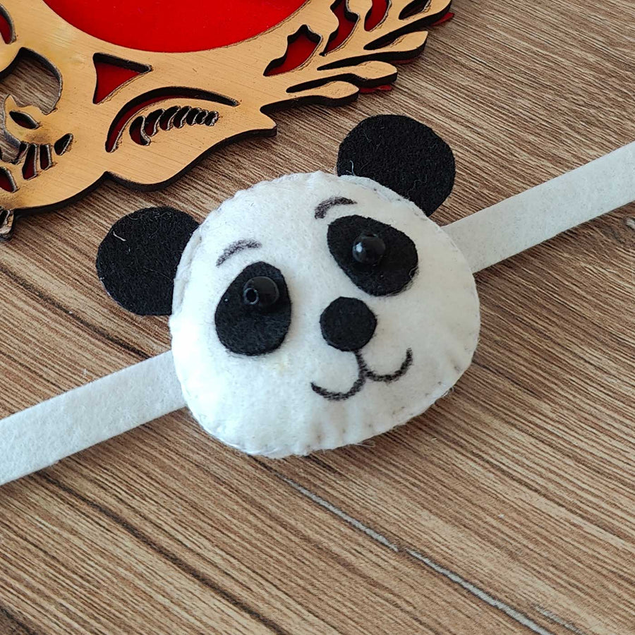 Handmade Panda Theme Felt Kids Rakhi With Roli Chawal - Close-up on Panda Headband Face