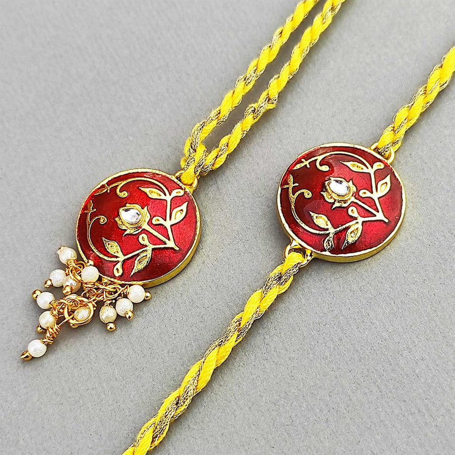 Handmade Meenakari Red Buta Brass Bhaiya Bhabhi Rakhi With Roli Chawal - Close-up of Rakhi Design