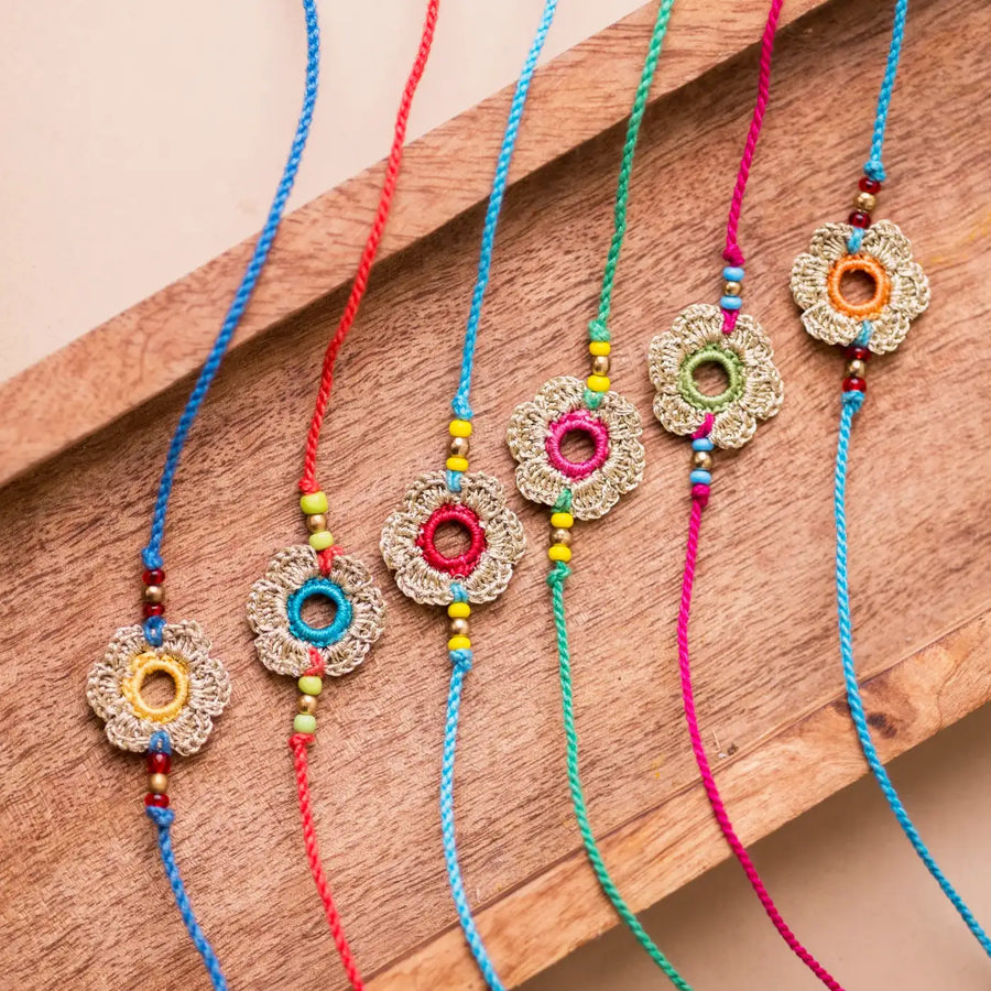 Handmade Crochet Multicolor Golden Flower Rakhi With Roli Chawal Set Of 6 - Top View Close-up