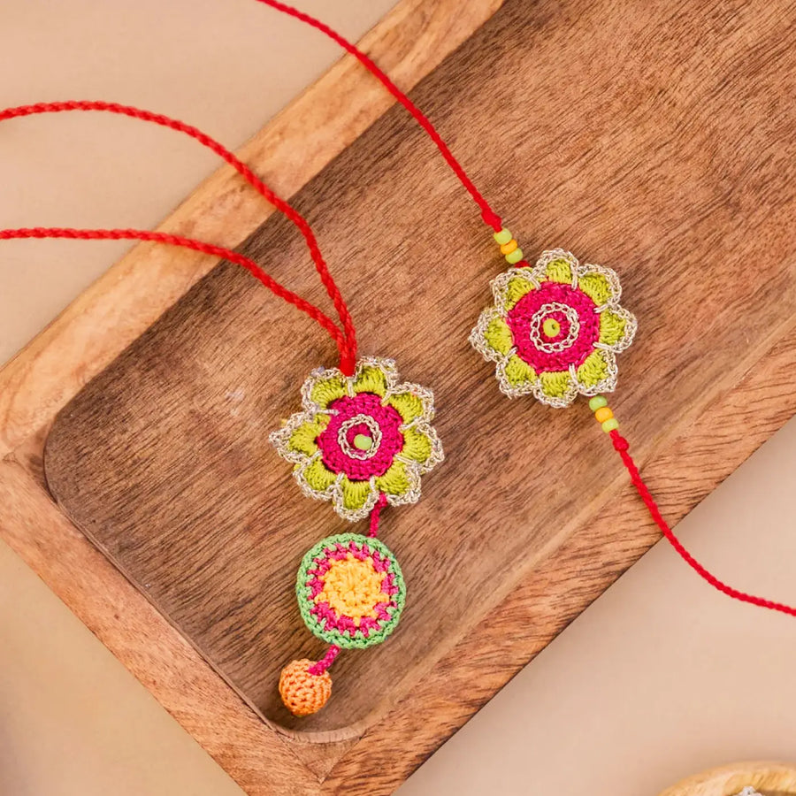 Handmade Crochet Green And Pink Bhaiya Bhabhi Rakhi With Roli Chawal Set Of 2 - Close-up Front View