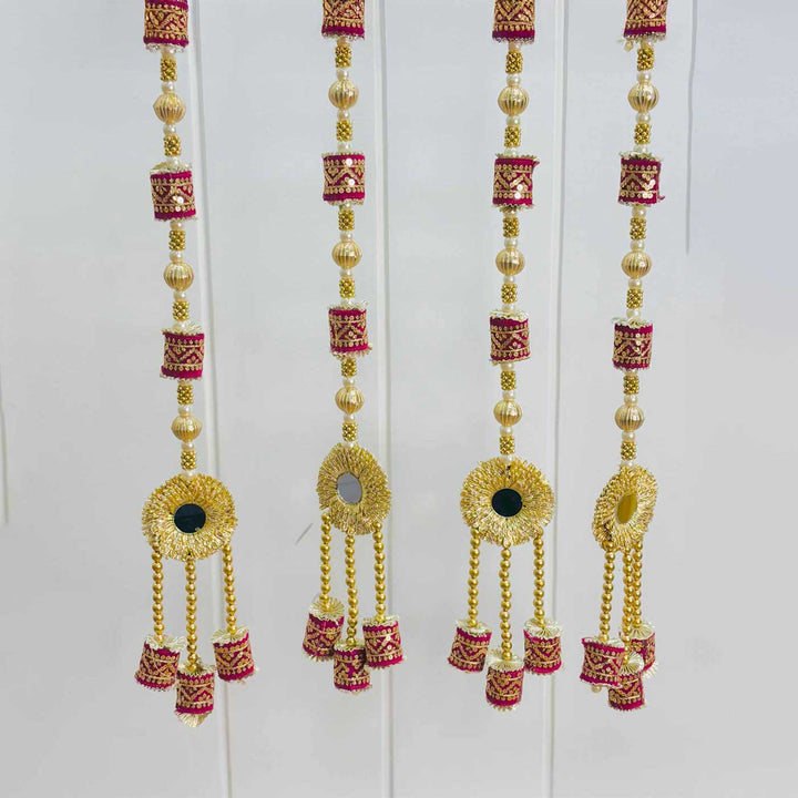Handcrafted Maroon Cylindrical Tassels Door Hangings With Mirror, Bells And Gold Bead Detailing